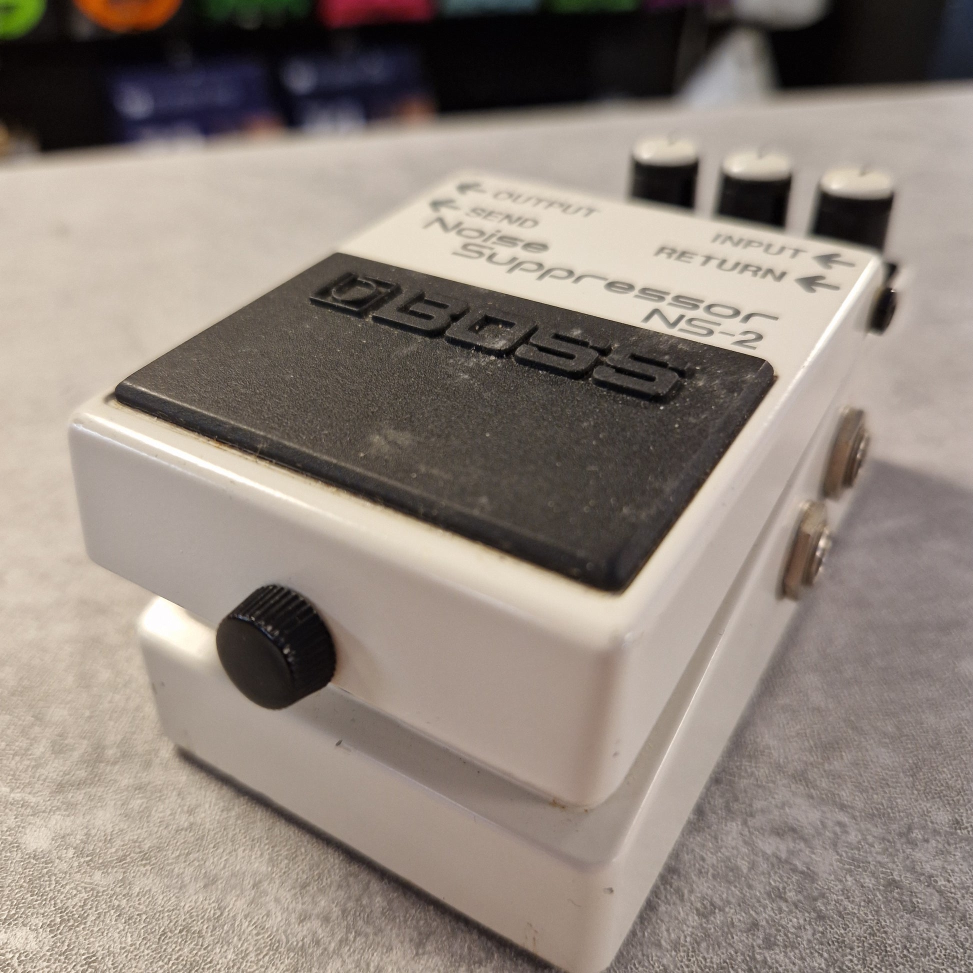 Pre-Owned Boss NS-2 Digital device with a display and control knob on a textured surface