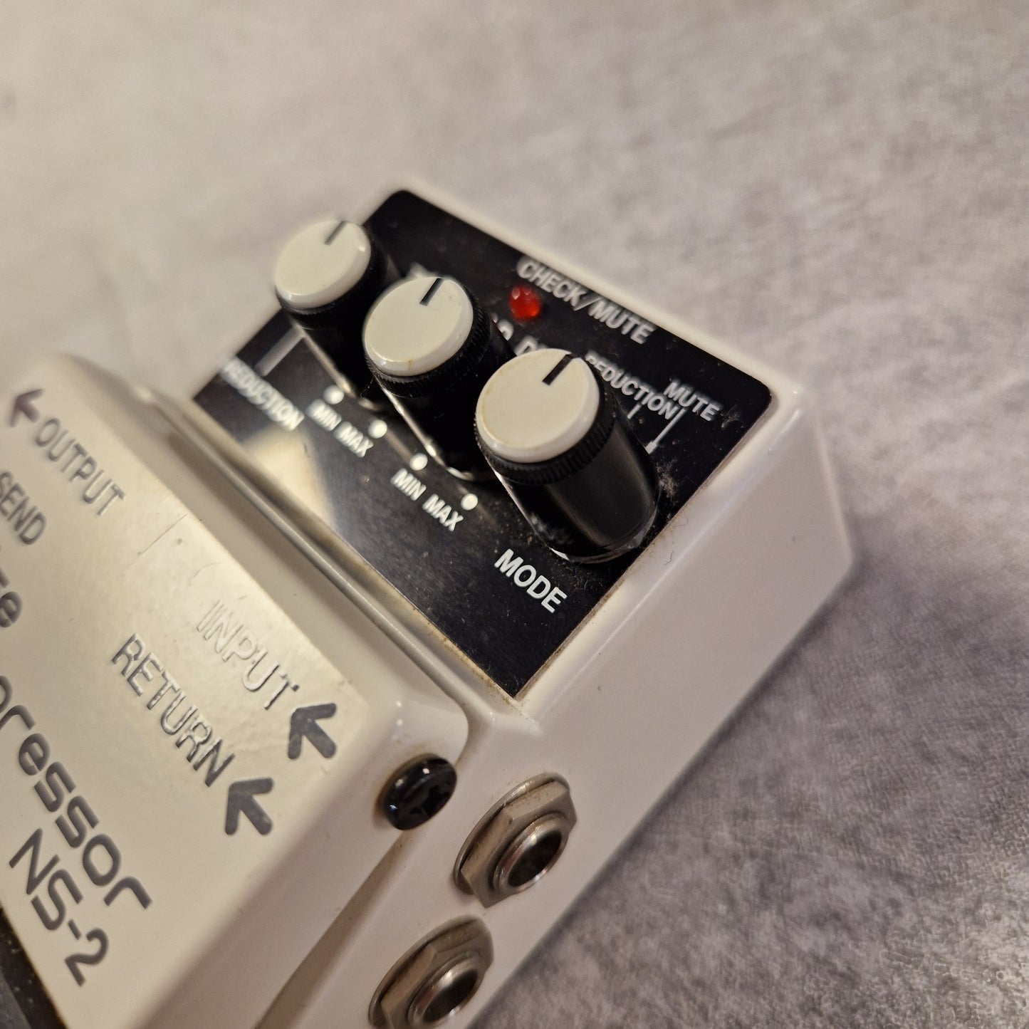 Pre-Owned Boss NS-2 Guitar effects pedal with control knobs and labels on a gray background
