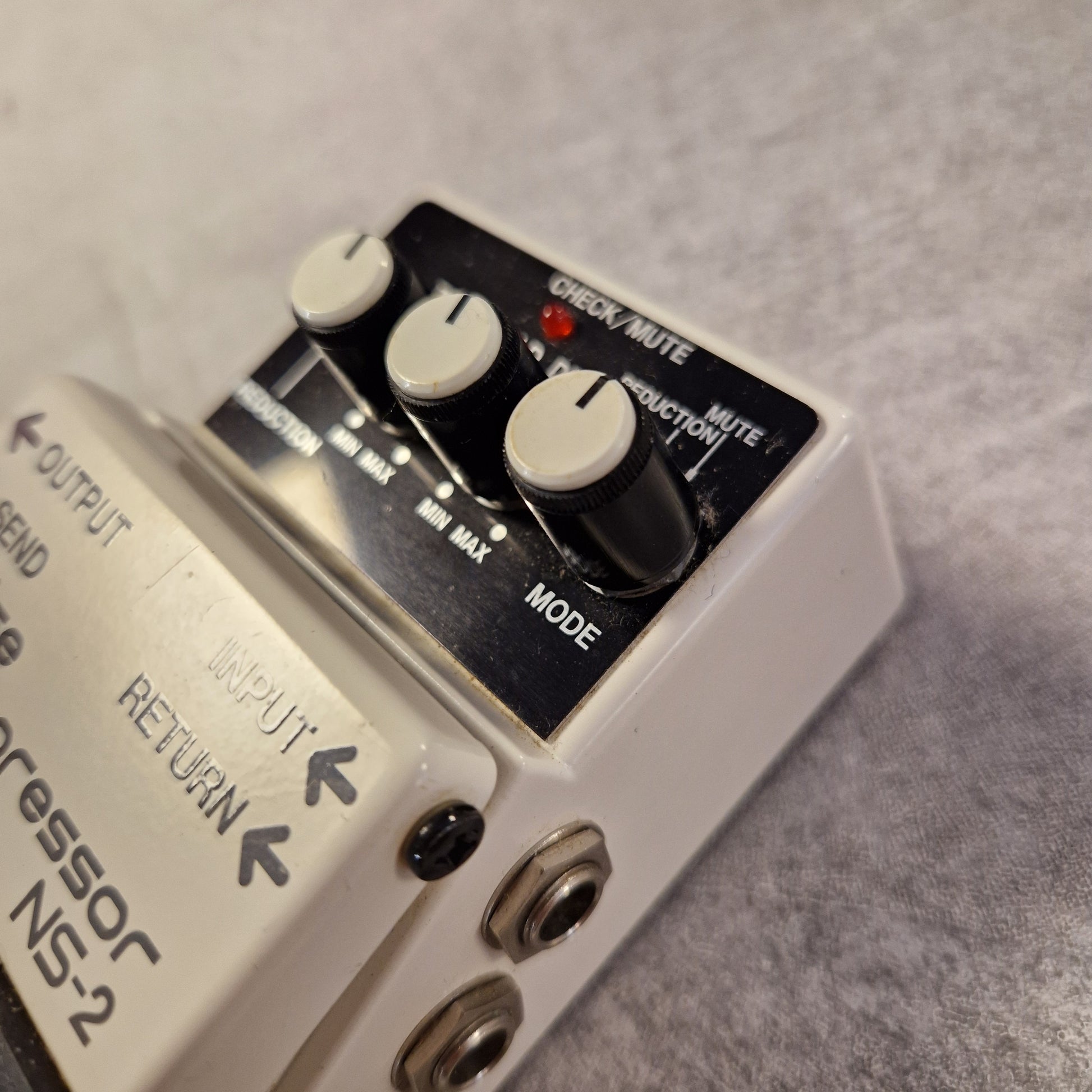 Pre-Owned Boss NS-2 Guitar effects pedal with control knobs and labels on a gray background