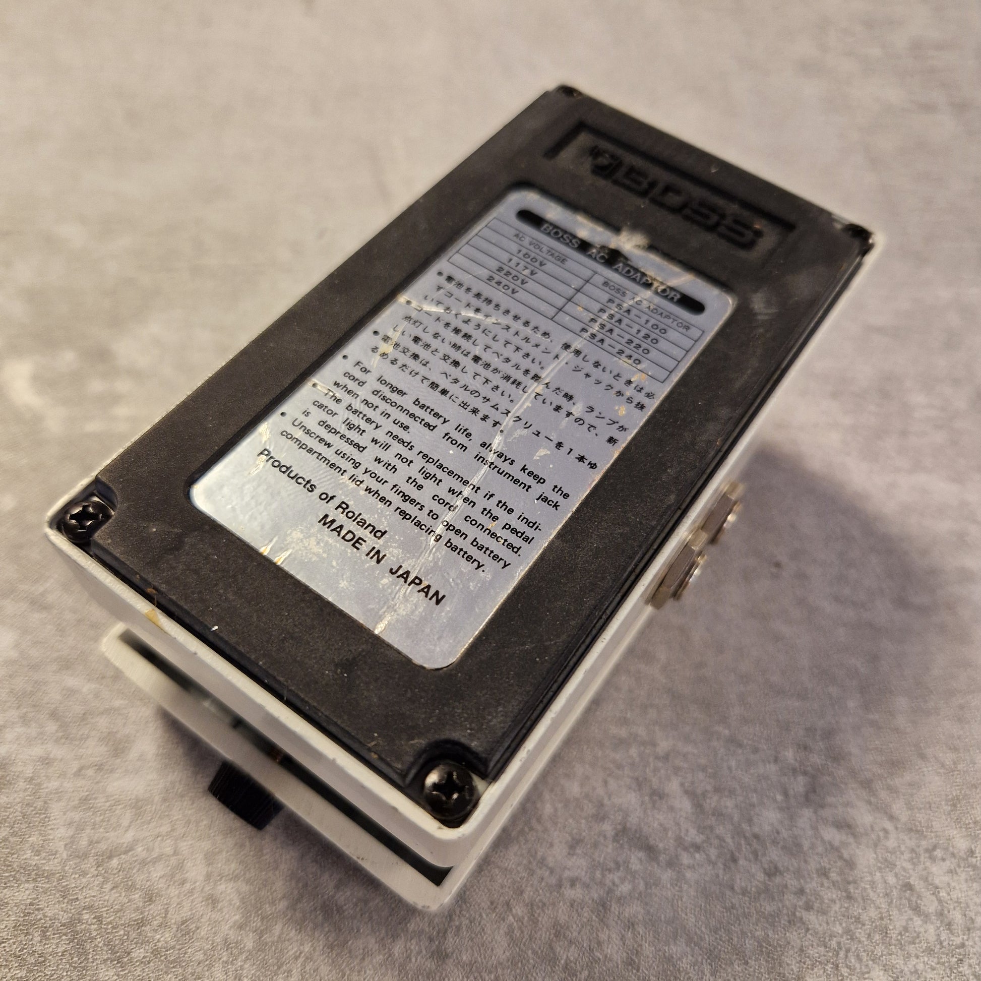 Pre-Owned Boss NS-2 Small electronic device with a label on a gray surface