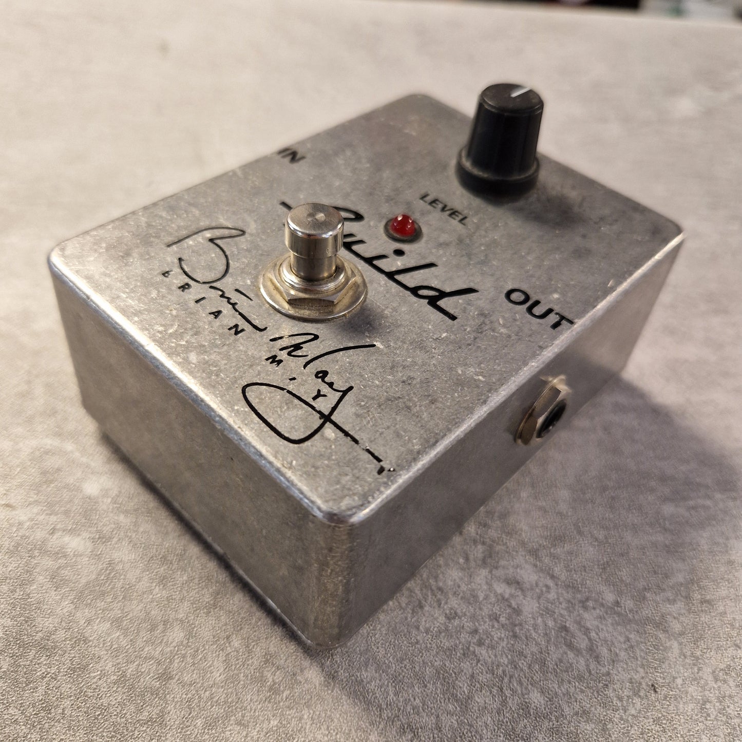 Pre-Owned Guild Brian May Metallic guitar effects pedal with branding on a textured surface