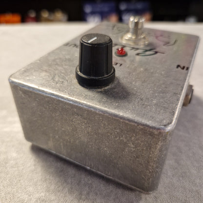 Pre-Owned Guild Brian May Metal toggle switch with a red indicator light on a gray surface
