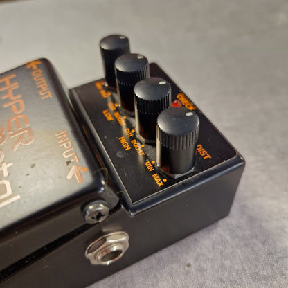 Pre-Owned Boss HM-3 Guitar effects pedal with knobs and labels on a gray background