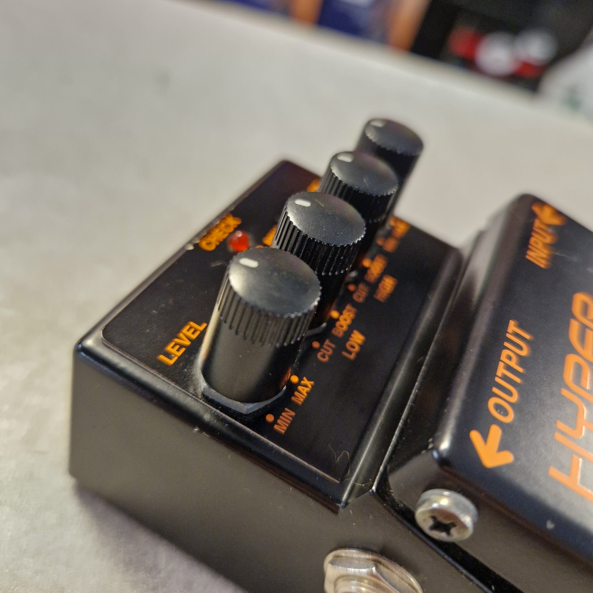 Pre-Owned Boss HM-3 Guitar effects pedal with knobs and 'HAPIGER' branding on a light background