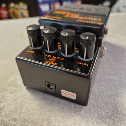 Pre-Owned Boss HM-3 Guitar effects pedal with three knobs on a textured surface