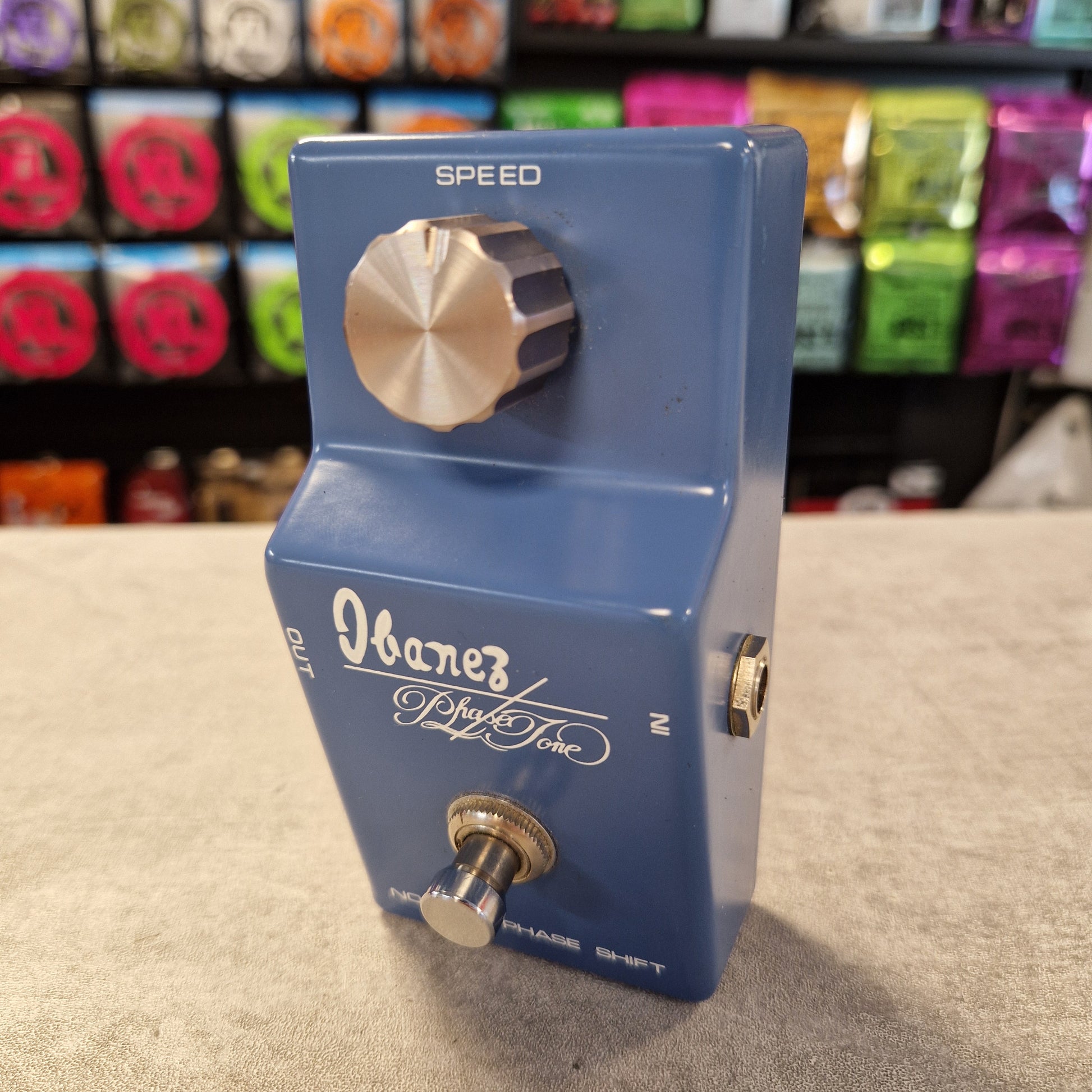 Pre-Owned Ibanez PT-999 Blue guitar effects pedal with knobs on a textured surface