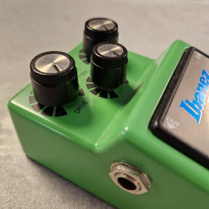 Pre-Owned Ibanez TS9 Green guitar effects pedal with two knobs and a label on a gray background
