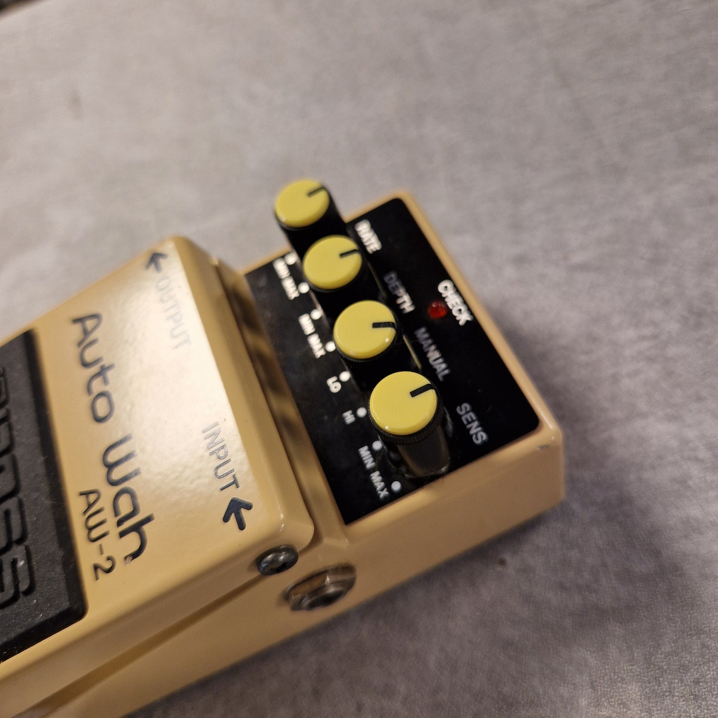 Pre-Owned Boss AW-2 Guitar effects pedal with 'Auto Wah AW-2' branding on a gray background