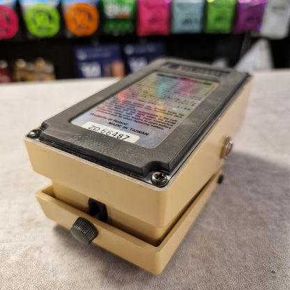 Pre-Owned Boss AW-2 Beige electronic device with colorful display on a textured surface