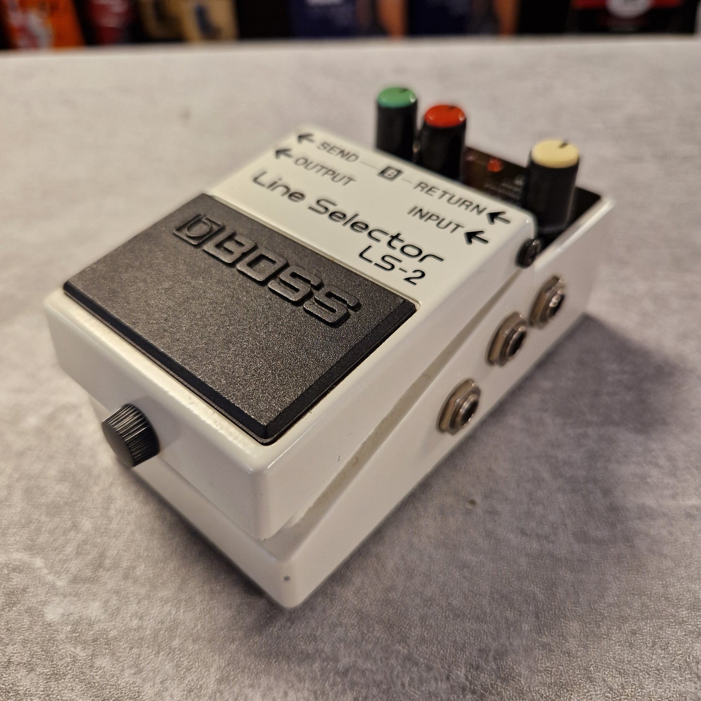 Pre-Owned Boss LS-2 Line Selector LS-2 guitar effects pedal on a textured surface