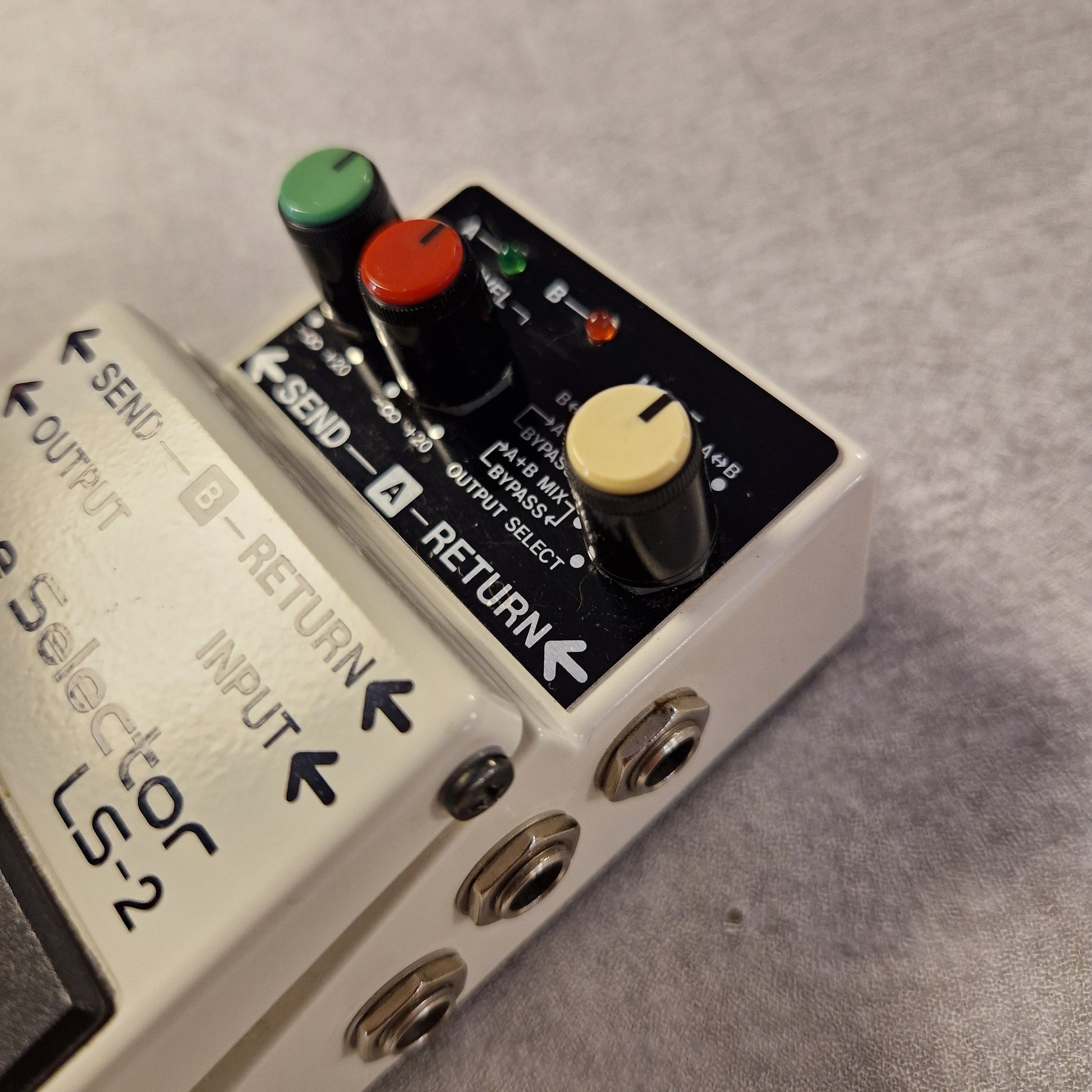 Pre-Owned Boss LS-2 Guitar effects pedal with control knobs and ports on a gray background