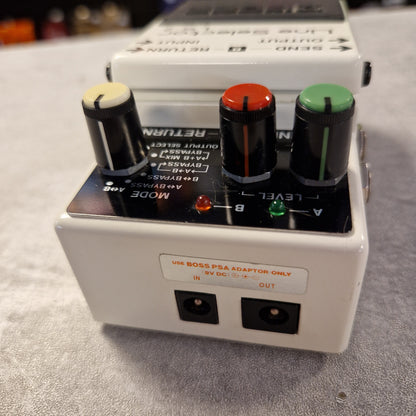 Pre-Owned Boss LS-2 White electronic pedal with knobs and ports on a gray surface