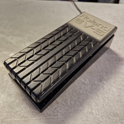 Pre-Owned Roland EV-5 Metallic foot pedal with 'Roland' branding on a gray surface
