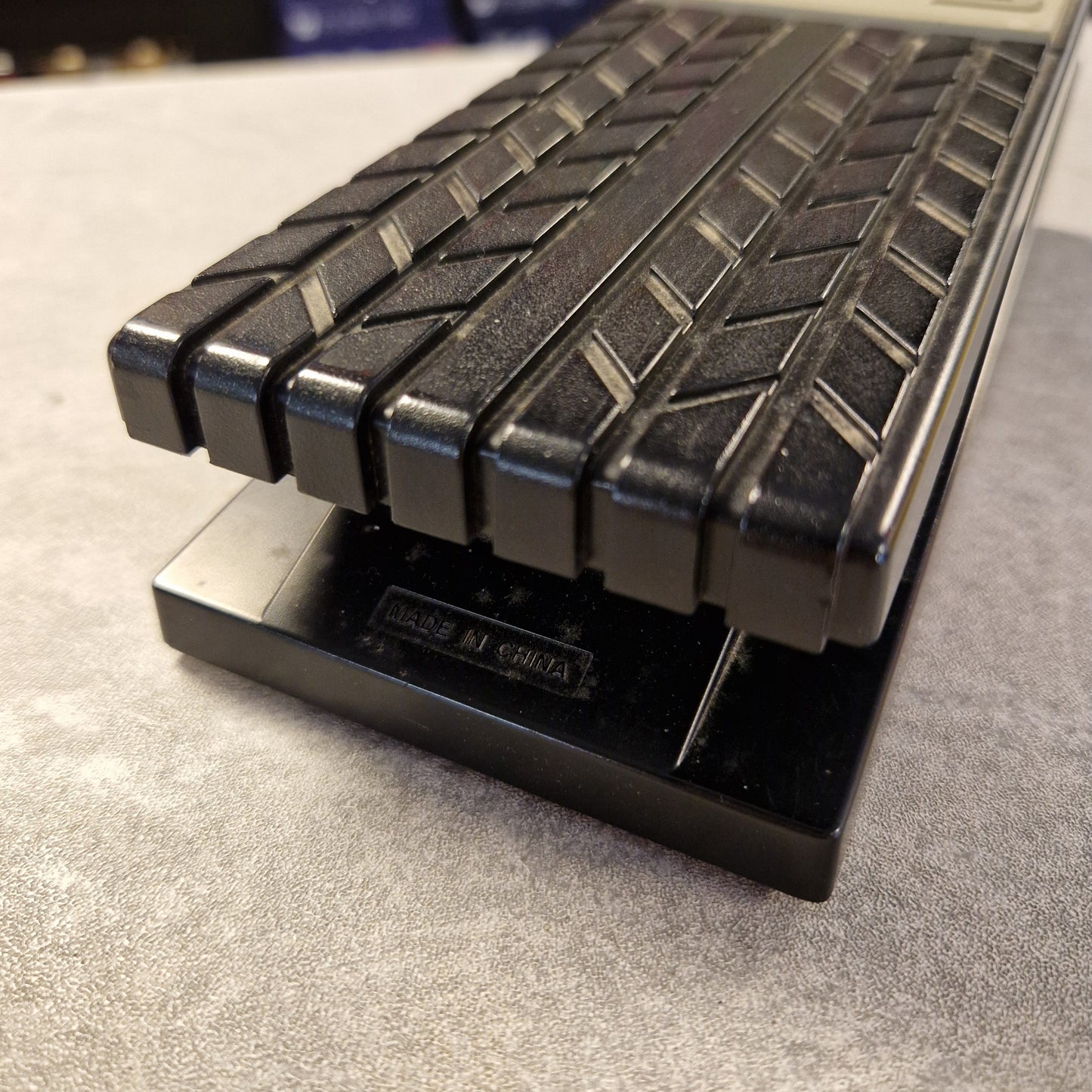 Pre-Owned Roland EV-5 Close-up of a textured black object on a gray surface