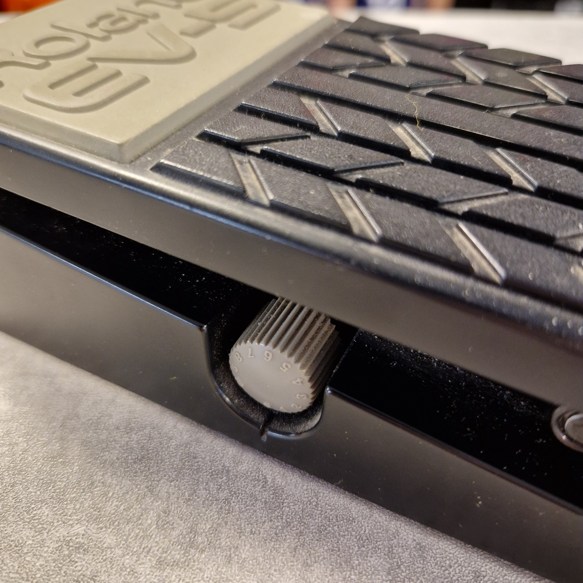 Pre-Owned Roland EV-5 Close-up of a mechanical device with a gear and textured surface