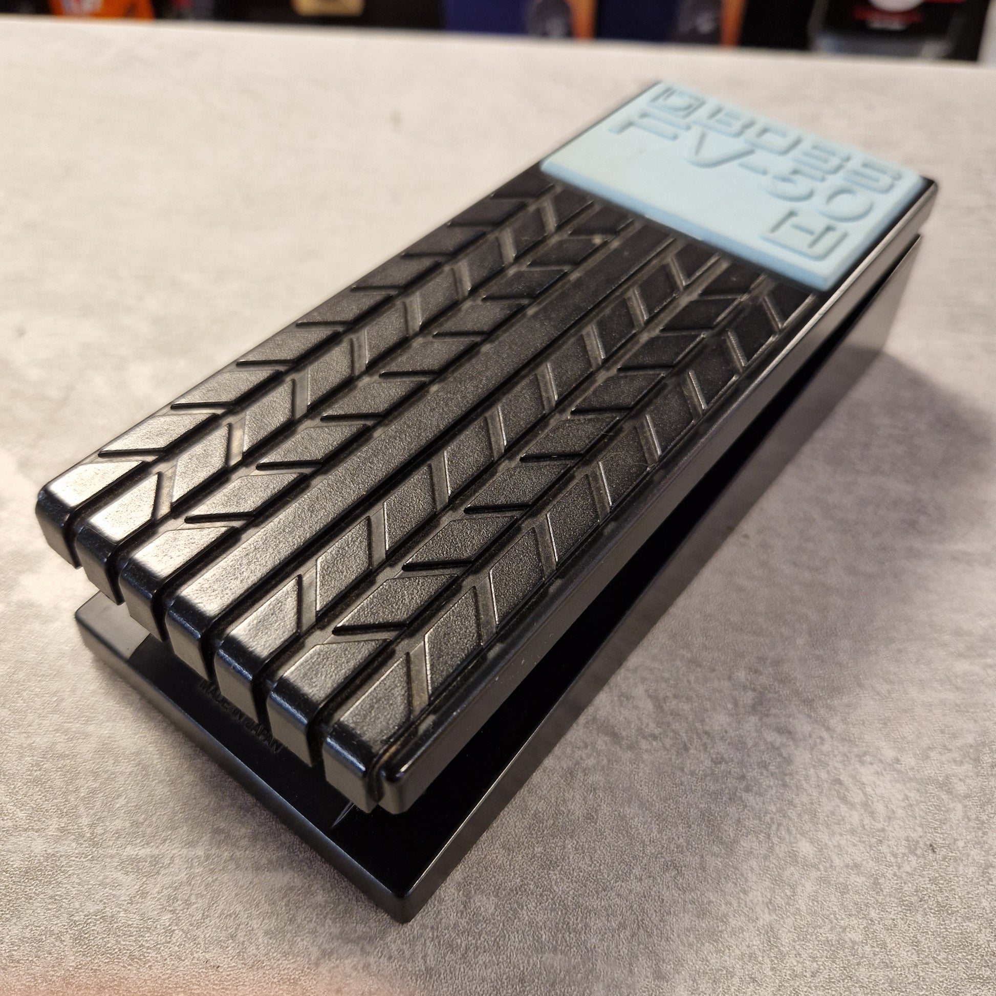 Pre-Owned Boss FV-50H Metallic grill on a textured surface with a visible brand label.