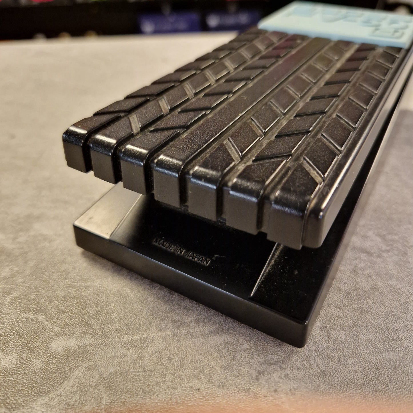 Pre-Owned Boss FV-50H Close-up of a textured black product on a gray surface