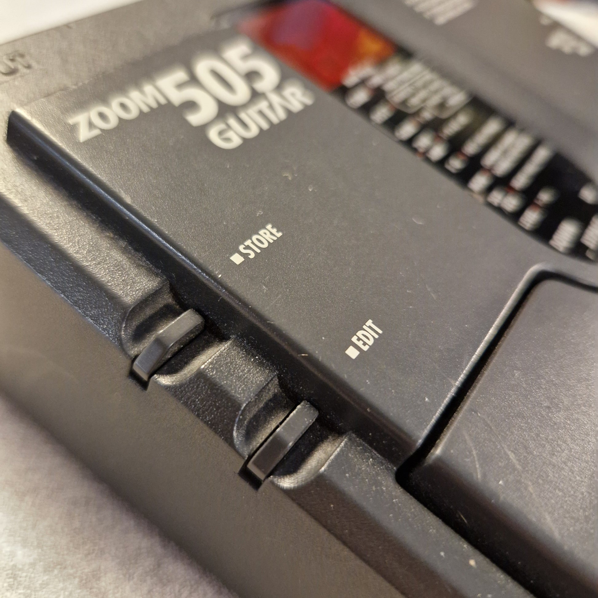 Pre-Owned Zoom 505 Close-up of a credit card with 'Zoonio 2025' branding on a gray background