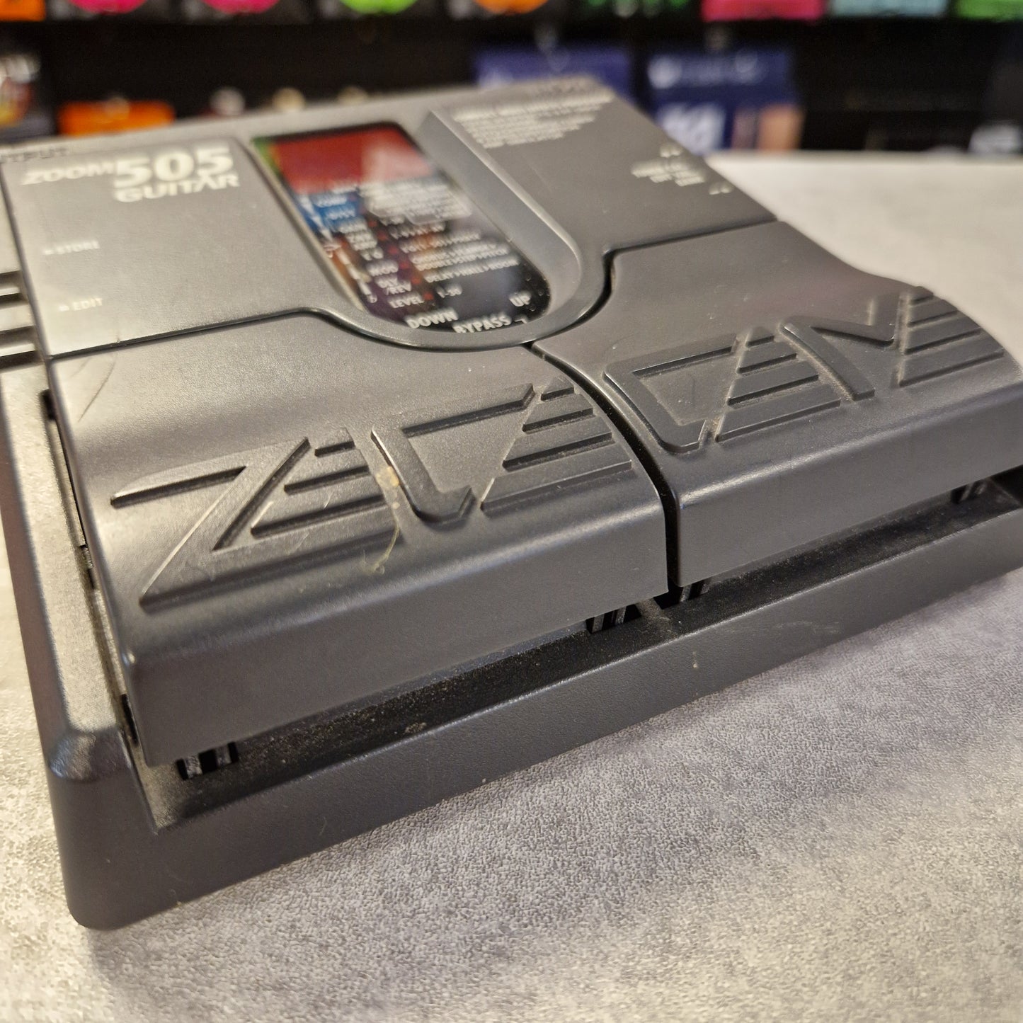 Pre-Owned Zoom 505 Gray electronic device with 'ZEV' branding on a textured surface