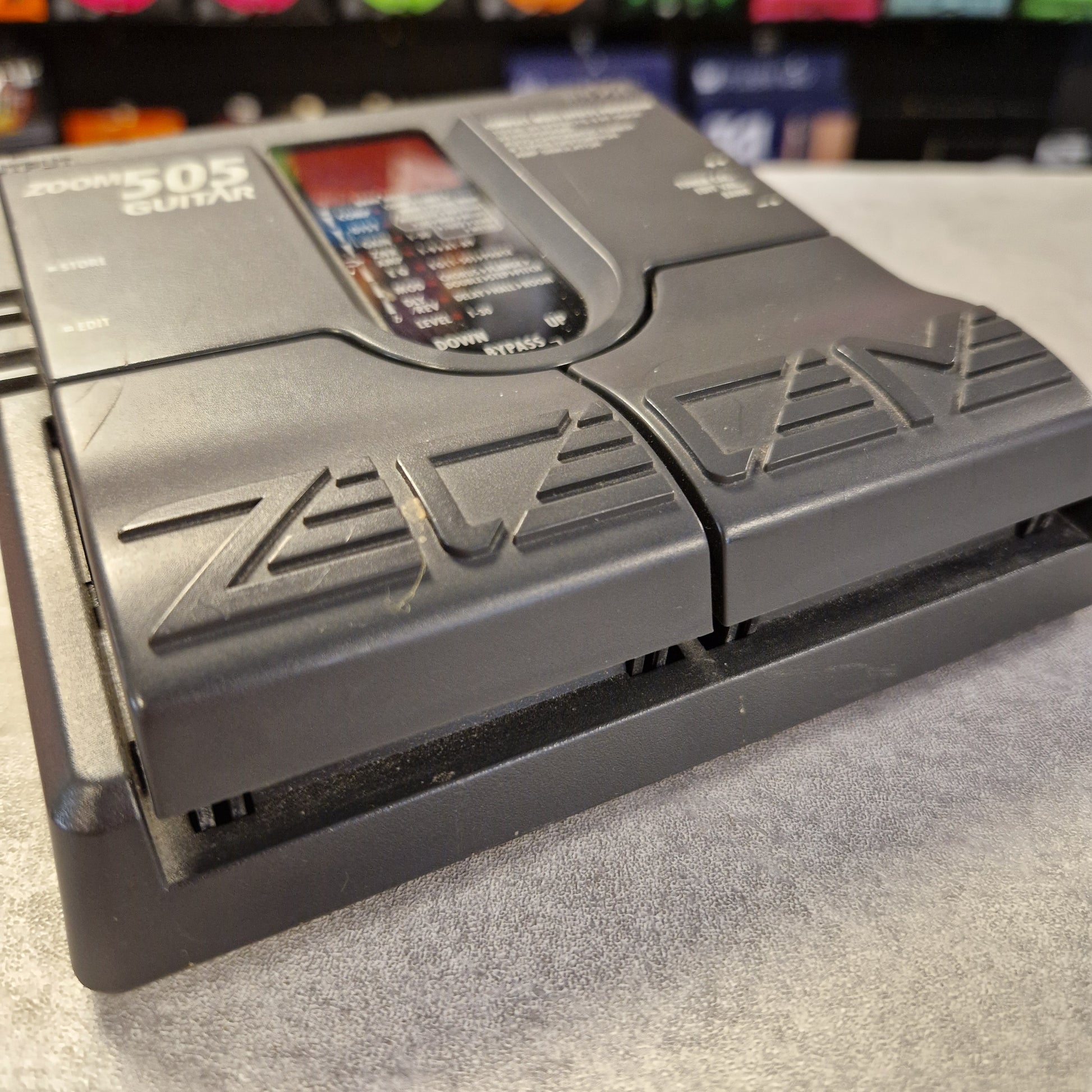 Pre-Owned Zoom 505 Gray electronic device with 'ZEV' branding on a textured surface