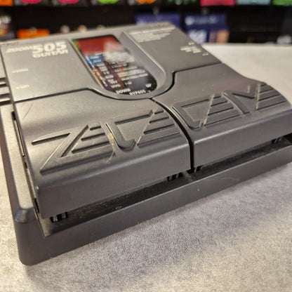Pre-Owned Zoom 505 Gray electronic device with 'ZEV' branding on a textured surface