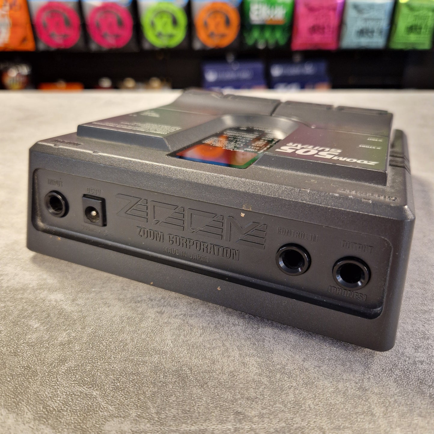 Pre-Owned Zoom 505 Cassette tape with visible branding on a textured surface