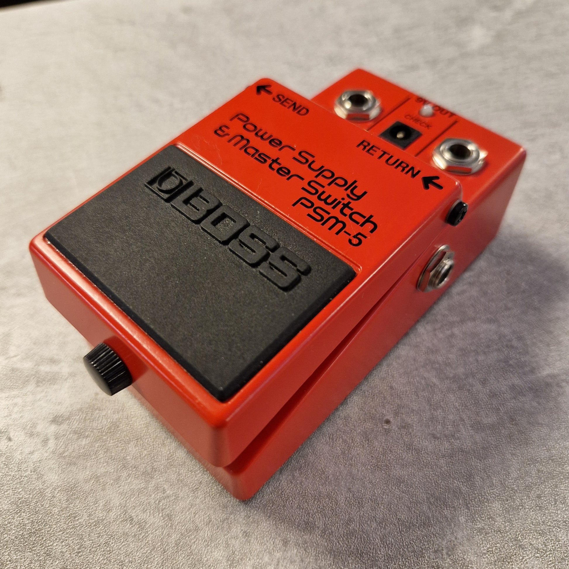 Pre-Owned Boss PSM-5  Red guitar effects pedal with digital display on a gray surface