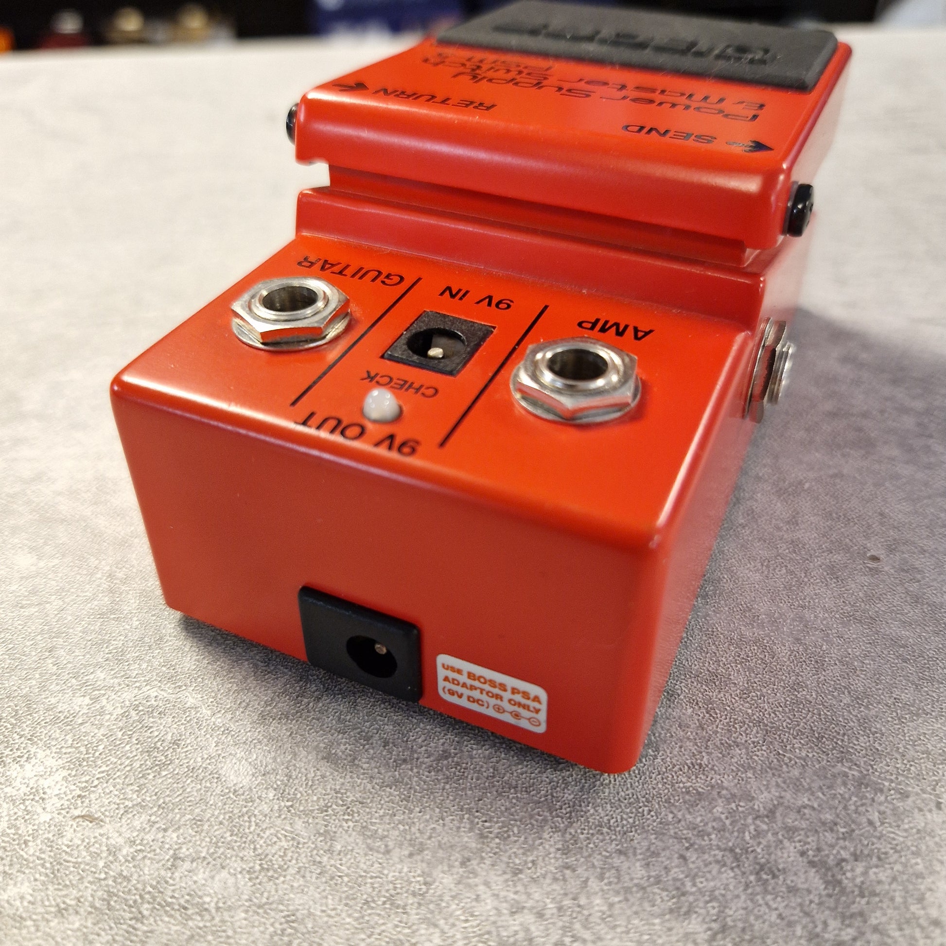Pre-Owned Boss PSM-5  Red guitar effects pedal on a gray surface