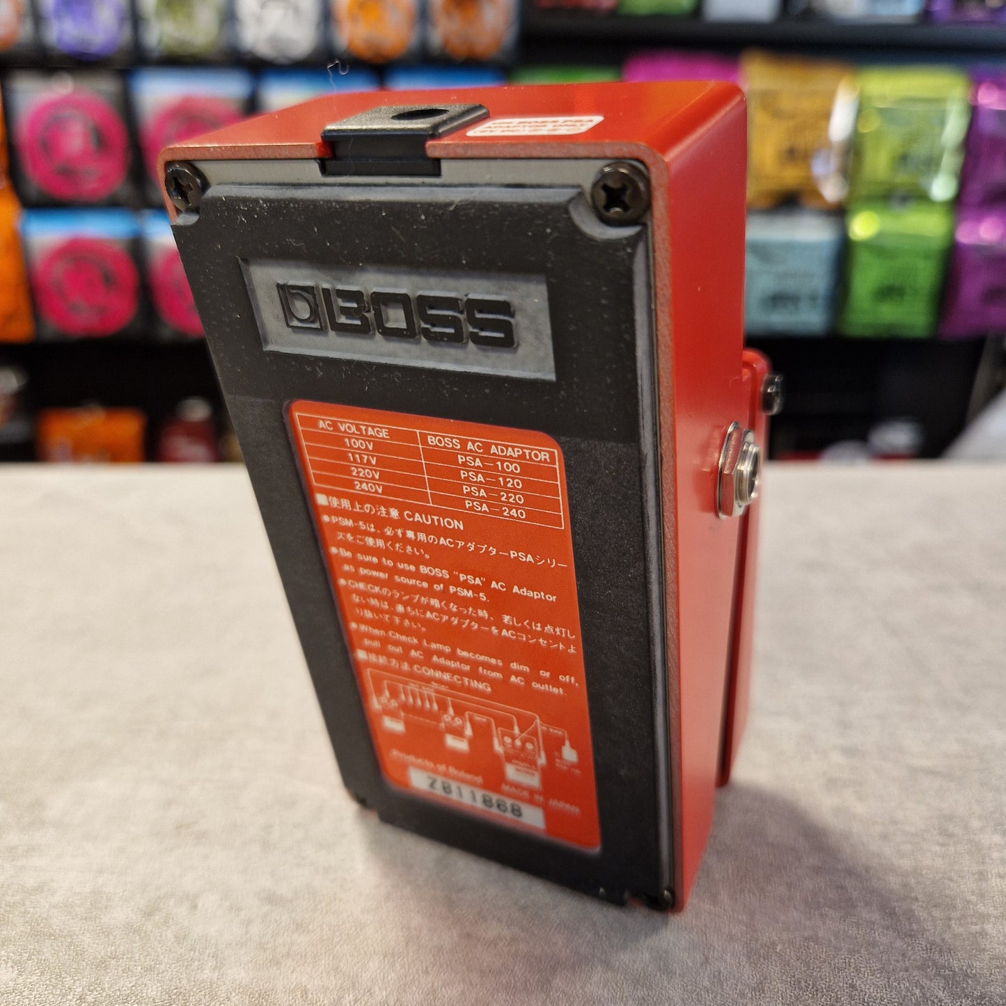 Pre-Owned Boss PSM-5 Red electronic device with 'SSDDE' branding on a textured surface.