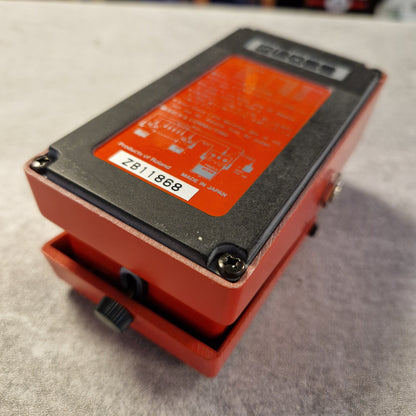 Pre-Owned Boss PSM-5 Red electronic device with a label on a gray surface