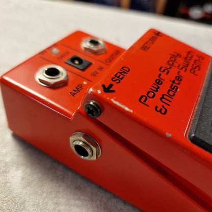 Pre-Owned Boss PSM-5 Red guitar effects pedal with visible brand name on a textured surface