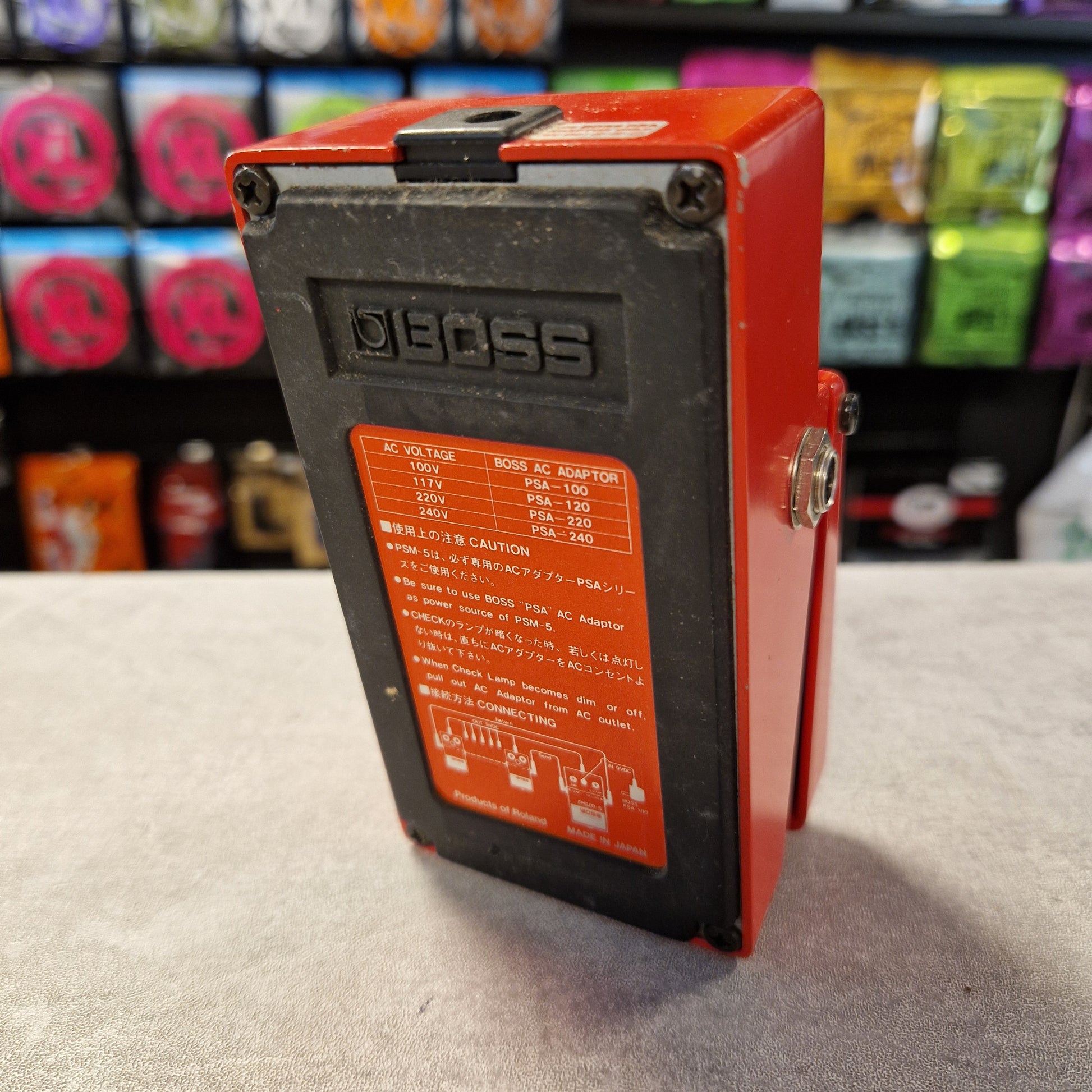 Pre-Owned Boss PSM-5 Red electronic device with a label on a textured surface