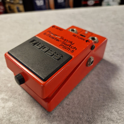 Pre-Owned Boss PSM-5 Red guitar effects pedal with 'Dunlop' branding on a gray surface.