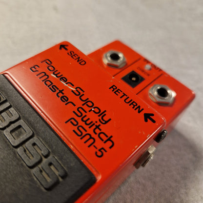 Pre-Owned Boss PSM-5 Red power supply and master switch with 'BOSS' branding on a gray background