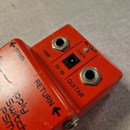Pre-Owned Boss PSM-5 Red electrical connector with labeled ports on a gray background