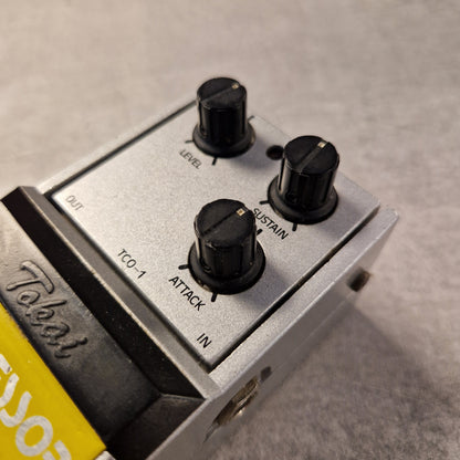 Pre-Owned Tokai TCO-1 Guitar effects pedal with knobs and 'Takes' branding on a gray background