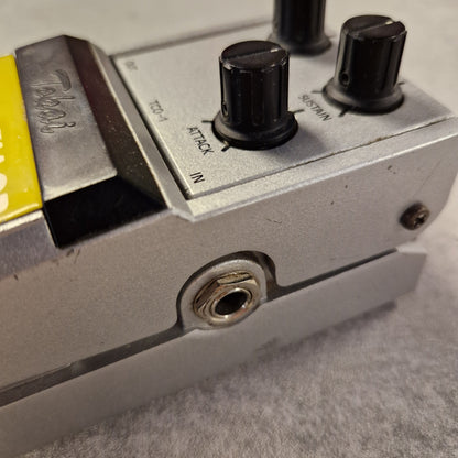 Pre-Owned Tokai TCO-1 Close-up of a Behringer audio effect pedal with knobs and labels.