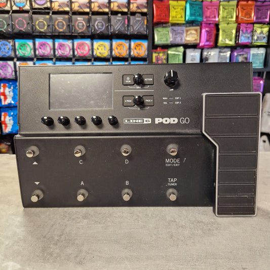 Pre-Owned Line 6 POD Go Black guitar effects pedal with colorful pedals in the background