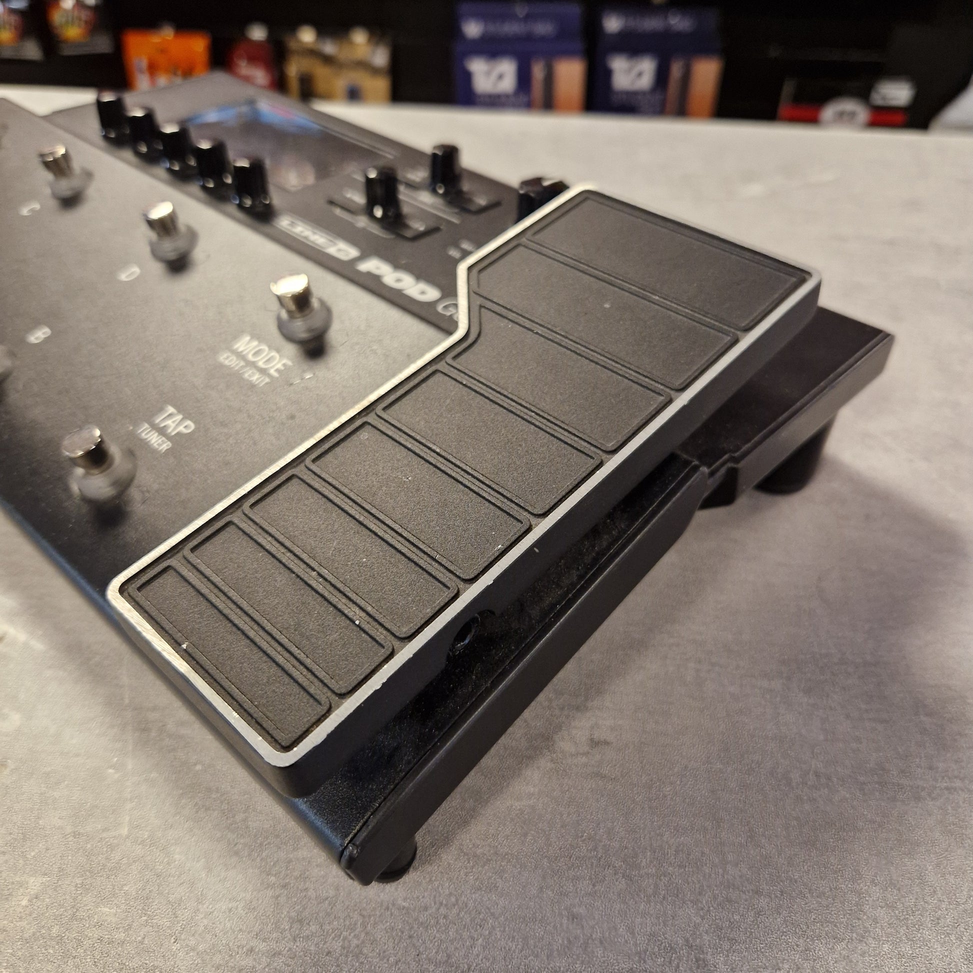 Pre-Owned Line 6 POD Go Guitar effects pedal with footswitch on a gray surface