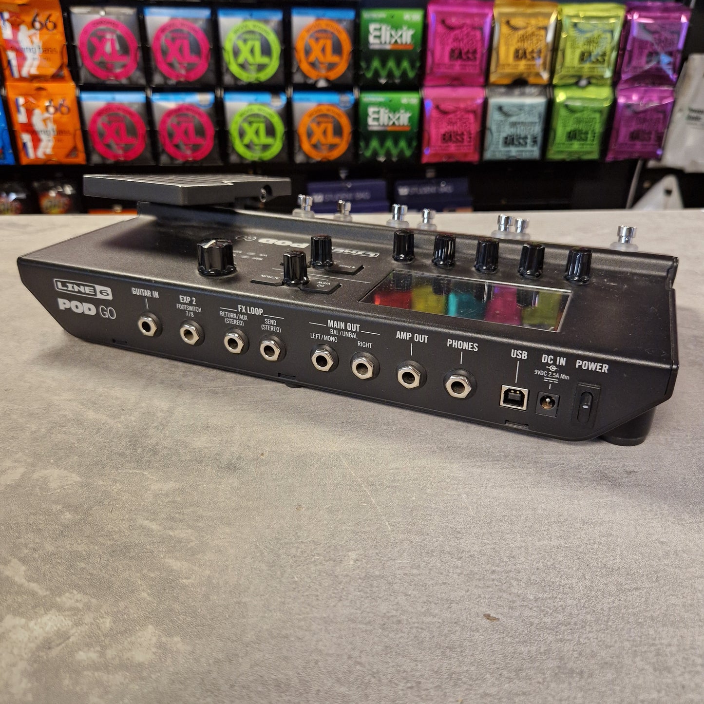 Pre-Owned Line 6 POD Go Guitar effects pedal board with multiple colorful effect units on a textured surface