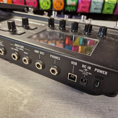 Pre-Owned Line 6 POD Go Guitar effects pedal board with various colorful effect units on a gray surface