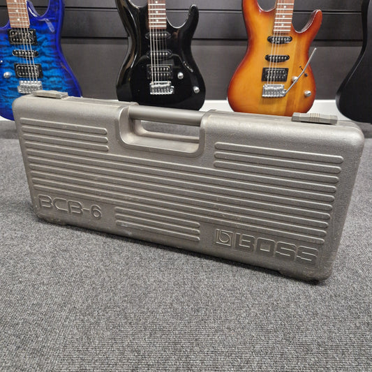Pre-Owned Boss BCB-6 Gray Deboe pedal board with guitars in the background