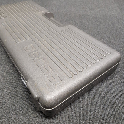 Pre-Owned Boss BCB-6 Metallic case with 'BOSS' branding on a textured gray surface