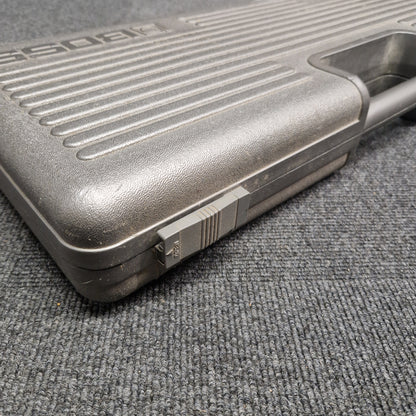 Pre-Owned Boss BCB-6 Close-up of a textured gun grip on a gray surface