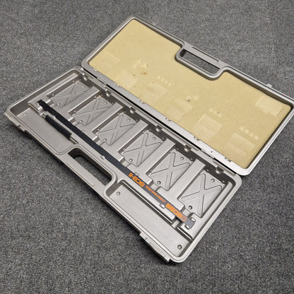 Pre-Owned Boss BCB-6 Metallic tool case with compartments on a gray textured background