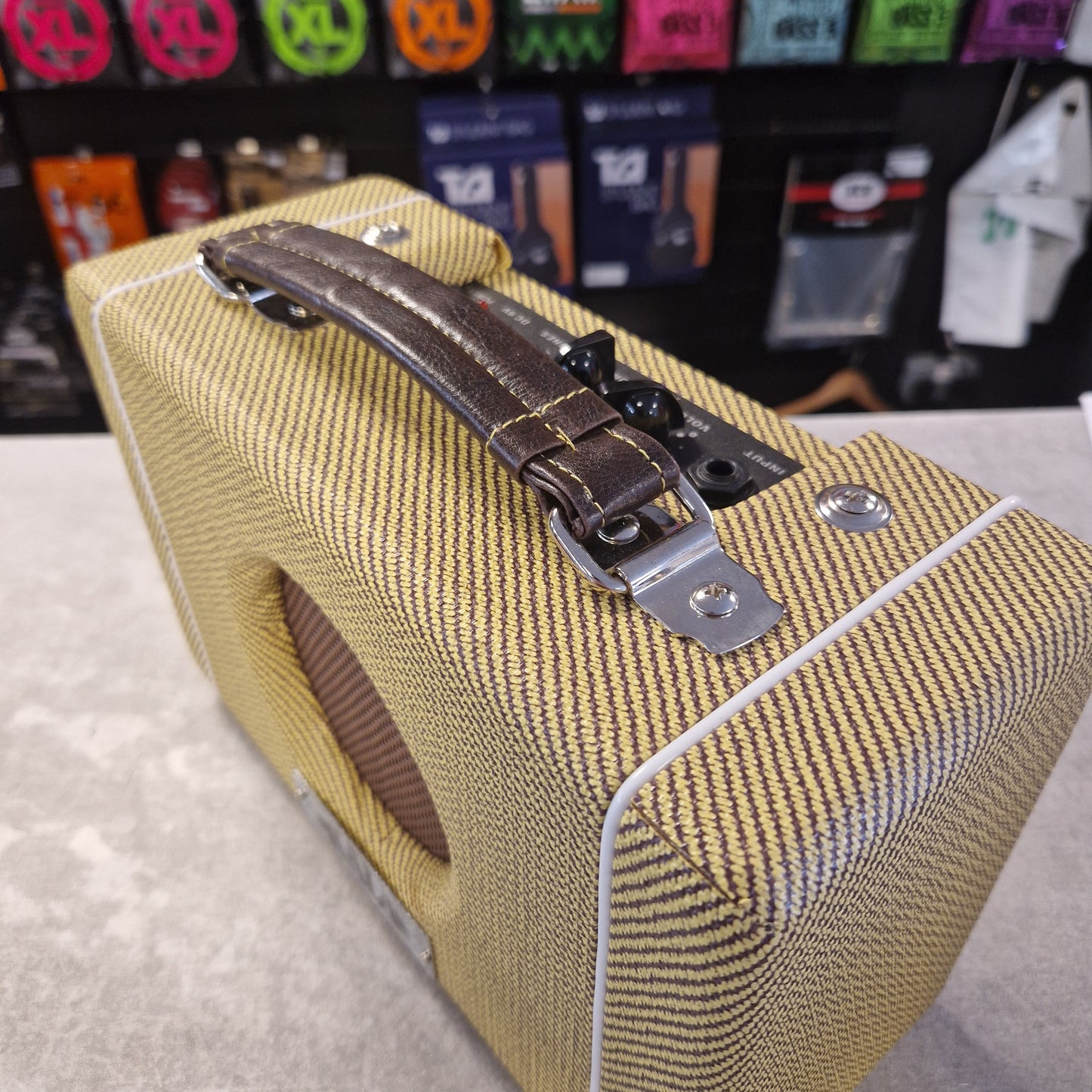 Pre-Owned Kala AMP-TWD Close-up of a guitar case with a visible brand logo in the background