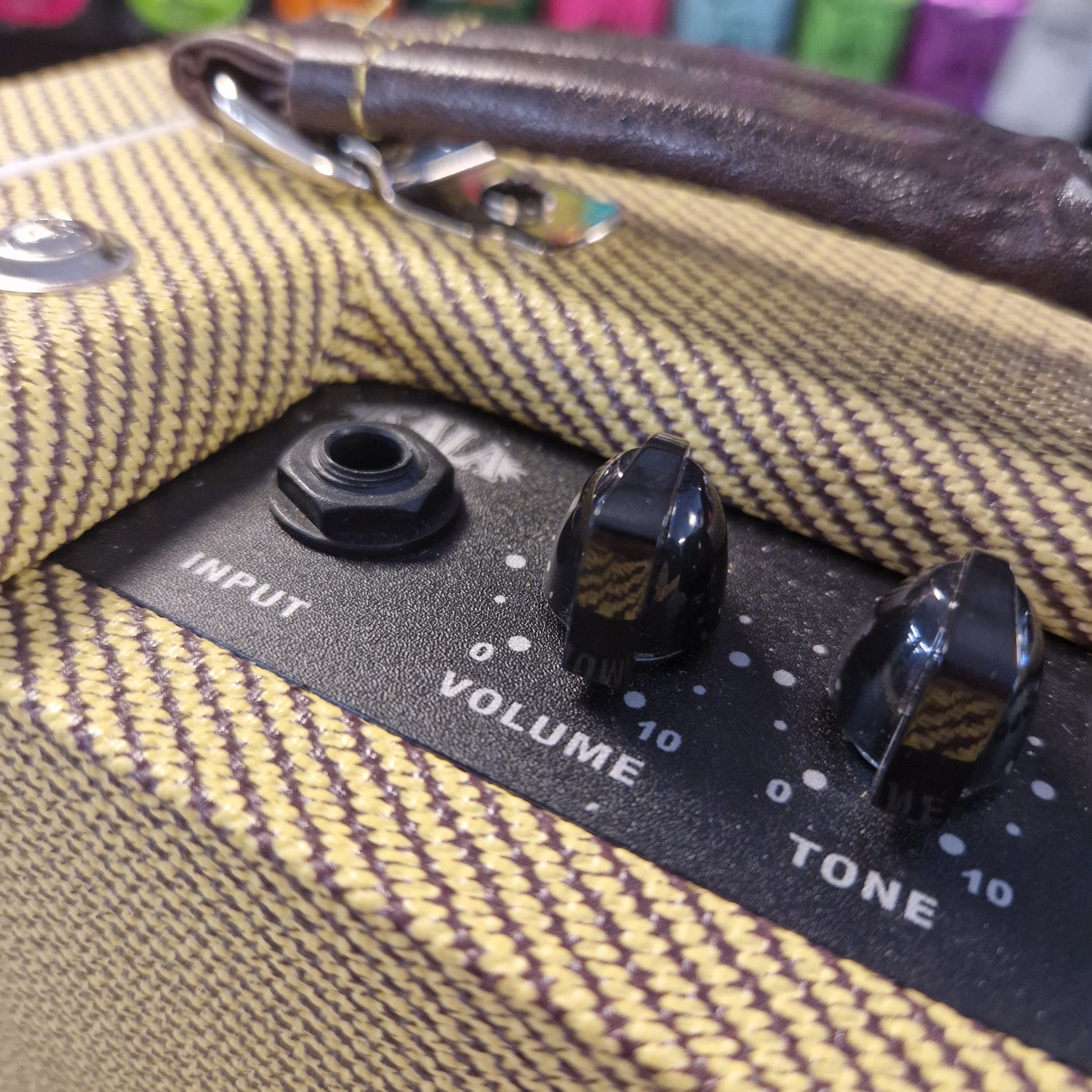 Pre-Owned Kala AMP-TWD Close-up of guitar amplifier controls on a textured surface