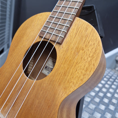 Pre-Owned Islander by Kanilea MT-4 Close-up of a wooden ukulele with a blurred background