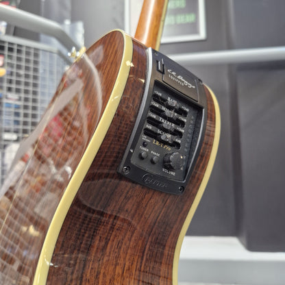 Pre-Owned Crafter TMC035/N Close-up of a guitar with a visible EQ control panel on a blurred background