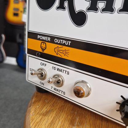 Pre-Owned Orange TT15H Close-up of a guitar amplifier with power output and switch labels.